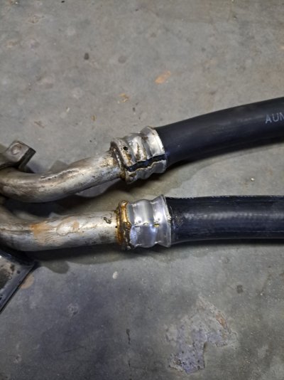 99 Suburban cracked crimp fitting on rear heater hose and tube assembly.jpg