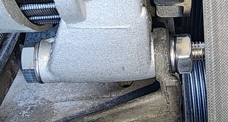 2024-01-09 - trimmed cast bracket for upgraded alternator - SS bolt w-washer and nut.jpg